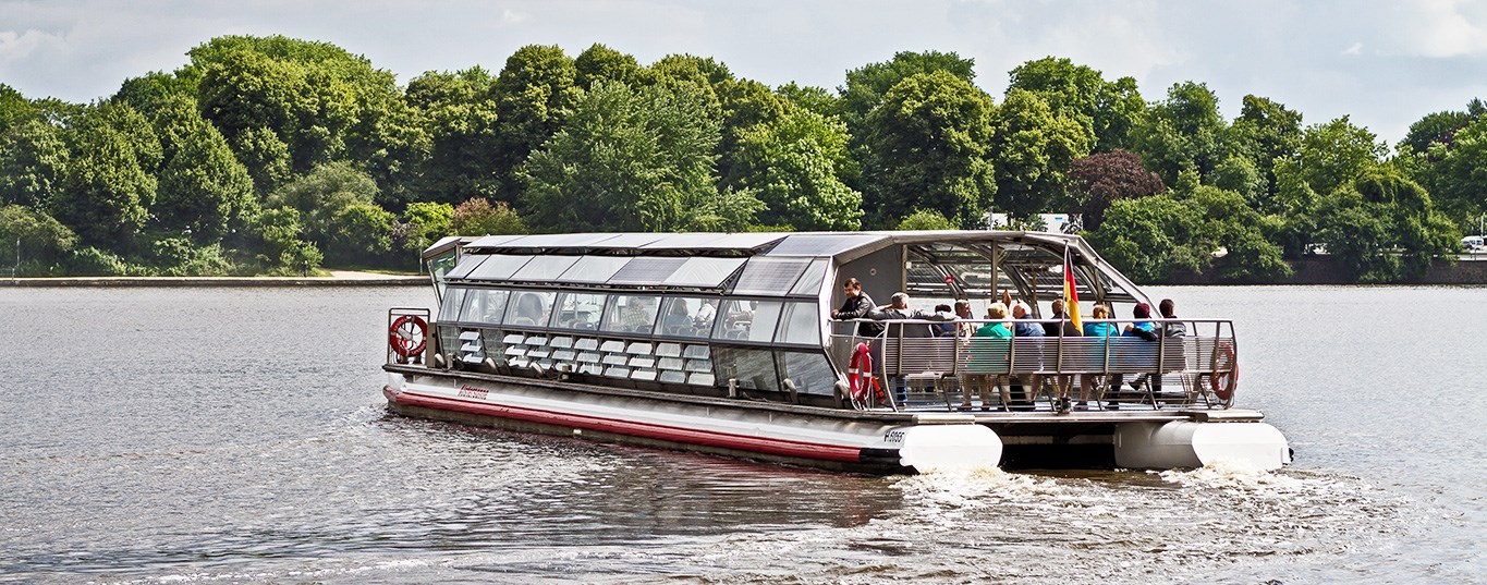 A solar-powered tourist boat on tour on a river in Hamburg, Germany